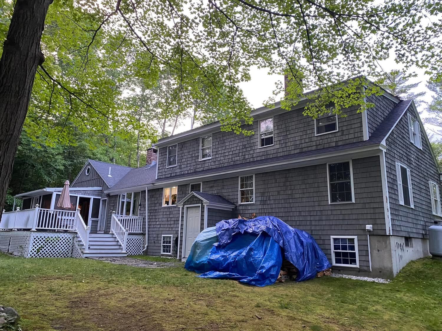 Cedar shingle colonial home during exterior renovation work