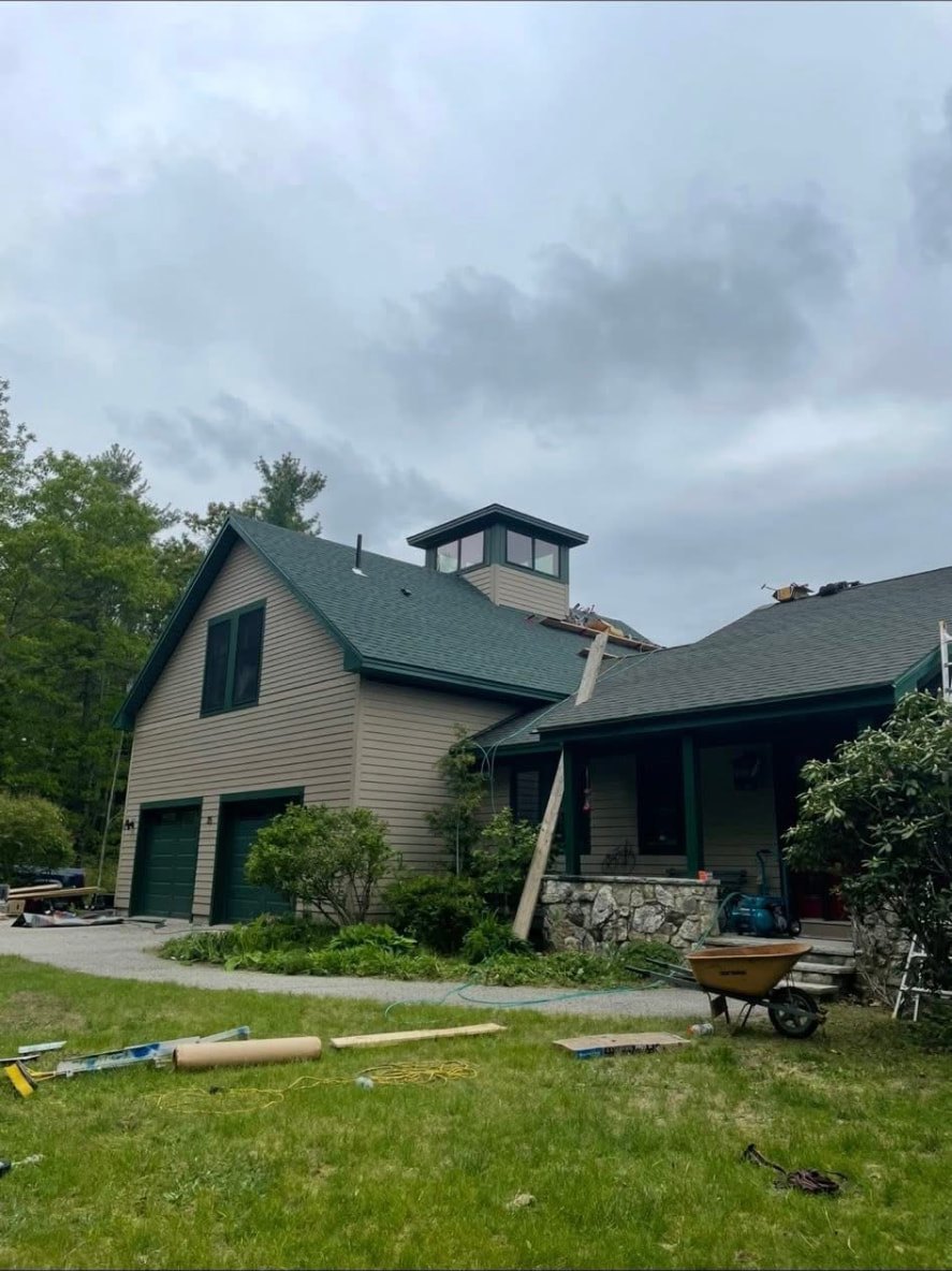 Completed green shingle roof replacement with cupola in Maine